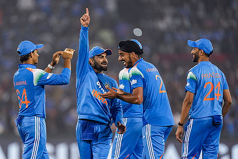 India's Virat Kohli with teammates celebrates the dismissal of South Africa's Quinton de Kock during the second ODI cricket match of a series between India and South Africa, at Shaheed Veer Narayan Singh International Stadium, in Raipur, Chhattisgarh.