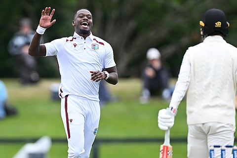 West Indies bowler Jayden Seales, left, celebrates the wicket of New Zealand's Zak Foulkes during during their cricket test match in Christchurch, New Zealand.