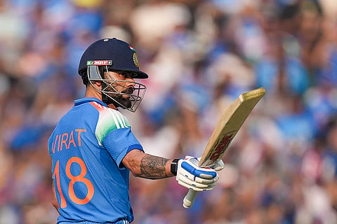 India's Virat Kohli celebrates his half century during the second ODI cricket match of a series between India and South Africa, at Shaheed Veer Narayan Singh International Stadium, in Raipur, Chhattisgarh.