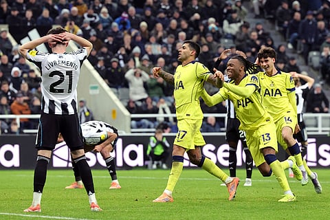 Tottenham Hotspur's Cristian Romero, center, celebrates scoring their side's second goal of the game during the Premier League soccer match between Newcastle United v Tottenham Hotspur in Newcastle, England.