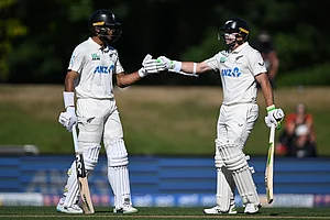 | Photo: Andrew Cornaga/Photosport via AP : New Zealand's batters Rachin Ravindra, left, and Tom Latham encourage each other while batting against the West Indies on day 3 during their cricket test match in Christchurch, New Zealand.