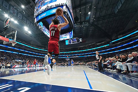 Miami Heat forward Jaime Jaquez Jr. tries to keep the ball in bounds against the Dallas Mavericks during the first half of an NBA basketball game in Dallas. 
