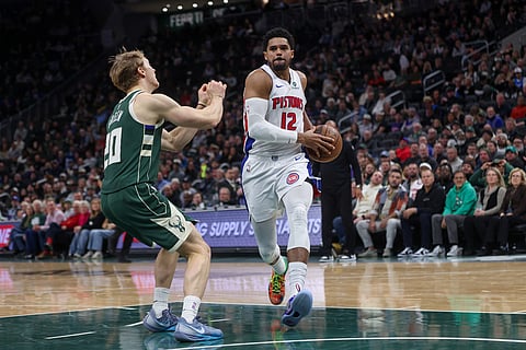 Detroit Pistons' Tobias Harris drives to the basket past Milwaukee Bucks' AJ Green during the second half of an NBA basketball game in Milwaukee. 
