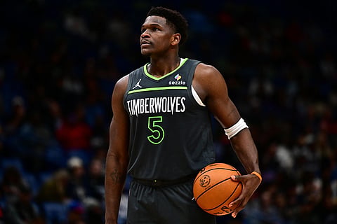 Minnesota Timberwolves guard Anthony Edwards looks on in the first half of an NBA basketball game against the New Orleans Pelicans in New Orleans.