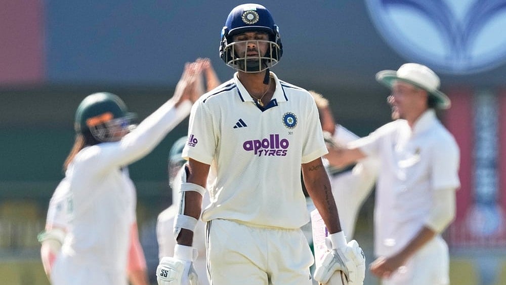 | Photo: AP/Anupam Nath : India's Washington Sundar walks off the field after losing his wicket on the fifth day of the second cricket test match between India and South Africa in Guwahati.