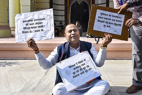 Independent MLC Banshidhar Brajwasi protests during the Winter session of the Bihar state Assembly, in Patna.