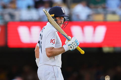 England's Joe Root celebrates his fifty runs during the second Ashes cricket test match between Australia and England in Brisbane.