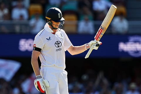 England's Zak Crawley celebrates his fifty runs during the second Ashes cricket test match between Australia and England in Brisbane.