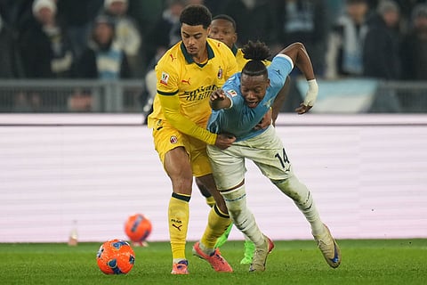 AC Milan's Koni De Winter holds Lazio's Tijjani Noslin during the Italian Cup round of sixteen soccer match between Lazio and Milan, in Rome.