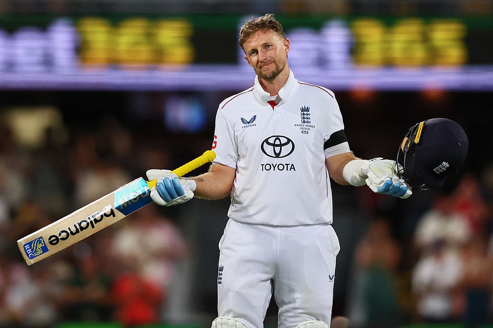 | Photo: AP/Tertius Pickard : England's Joe Root celebrates his century during the second Ashes cricket test match between Australia and England in Brisbane.