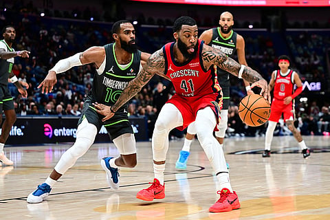 New Orleans Pelicans guard/forward Saddiq Bey (41) fends off Minnesota Timberwolves guard Mike Conley (10) in the second half of an NBA basketball game in New Orleans.