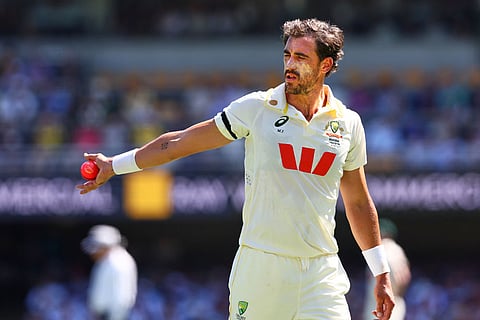Australia's Mitchell Starc ready to bowl during the second Ashes cricket test match between Australia and England in Brisbane.