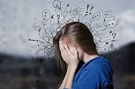 A woman with hands on her face