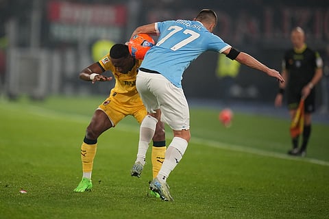 AC Milan's Pervis Estupinan.left, and Lazio's Adam Marusic fight for the ball during the Italian Cup round of sixteen soccer match between Lazio and Milan, in Rome.