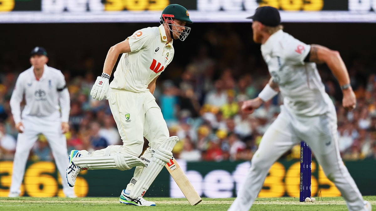 (AP Photo/Tertius Pickard) : Australia's Cameron Green runs between the wickets during the second Ashes cricket test match between Australia and England in Brisbane, Friday, Dec. 5, 2025