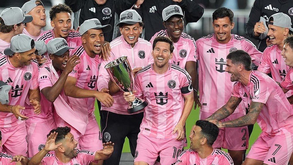 | Photo: AP/Rebecca Blackwell : Inter Miami forward Lionel Messi (10) holds the trophy as Inter Miami players celebrate winning an MLS Eastern Conference final soccer match against New York City FC, in Fort Lauderdale, Florida. 
