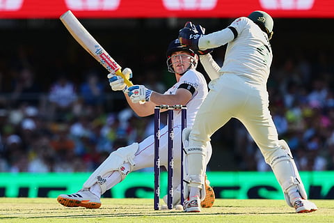 England's Harry Brook survives from the stumping during the second Ashes cricket test match between Australia and England in Brisbane.