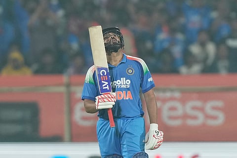 India's Rohit Sharma celebrates his fifty runs during the third One Day International cricket match between India and South Africa in Visakhapatnam.