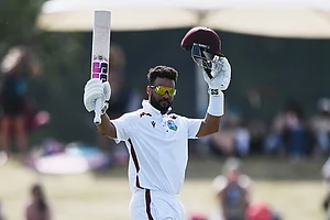 | Photo: Chris Symes/Photosport via AP : West Indies' Shai Hope celebrates scoring 100 runs against New Zealand on Day 4 of their cricket test match in Christchurch, New Zealand.