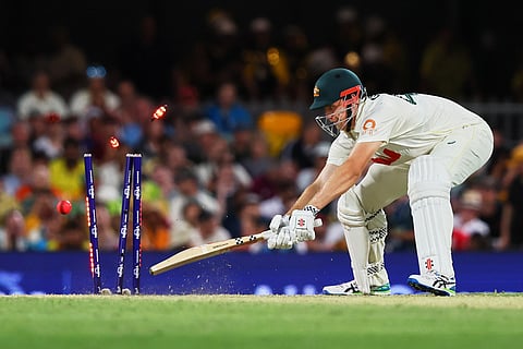 Australia's Cameron Green bowled out by England's Brydon Carse during the second Ashes cricket test match between Australia and England in Brisbane.