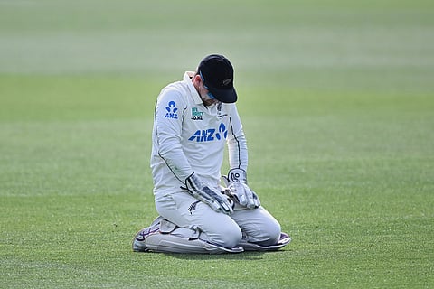 New Zealand's captain Tom Latham kneels on the ground late on Day 5 of their cricket test match against the West Indies in Christchurch, New Zealand.