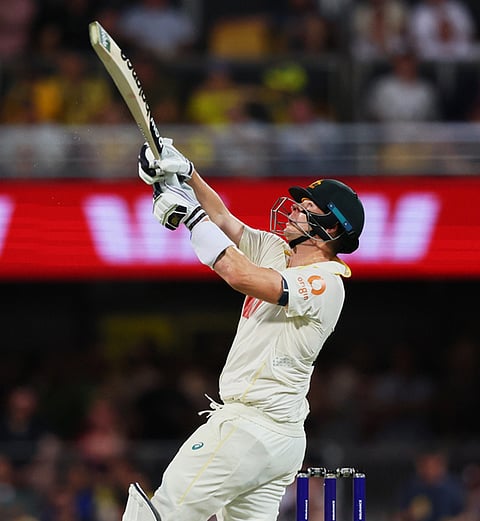 Australia's captain Steve Smith hits a six during the second Ashes cricket test match between Australia and England in Brisbane.