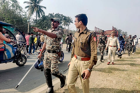 Security personnel stand guard near Beldanga Railway station, in Murshidabad. Suspended TMC MLA Humayun Kabir on Saturday laid the foundation stone for a mosque, modelled on Ayodhya’s Babri Masjid, at Rejinagar in West Bengal’s Murshidabad district, escalating political temperatures in the state. 