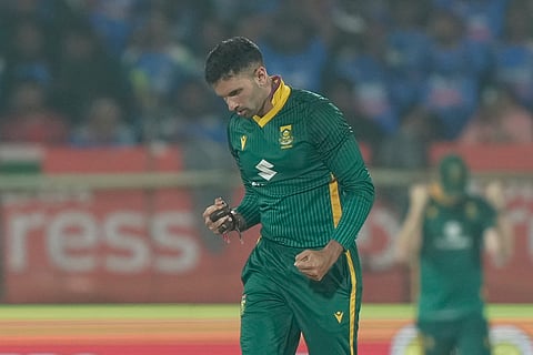South Africa's Keshav Maharaj celebrates the wicket of India's Rohit Sharma during the third One Day International cricket match between India and South Africa in Visakhapatnam.