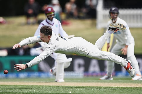 New Zealand's Michael Bracewell dives while fielding against the West Indies on Day 4 of their cricket test match in Christchurch, New Zealand.