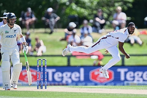 West Indies' Jayden Seales, right, bowls to New Zealand on day 4 of their cricket test match in Christchurch, New Zealand.