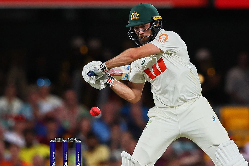 | Photo: AP/Tertius Pickard : Australia's Michael Neser plays a shot during the second Ashes cricket test match between Australia and England in Brisbane.