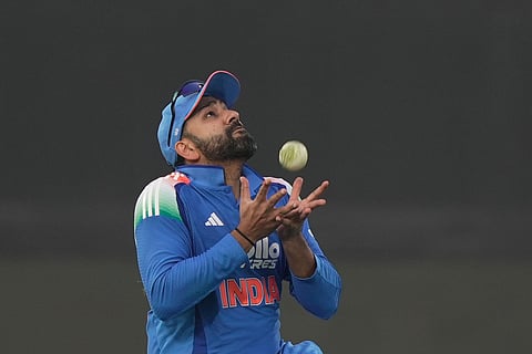 India's Rohit Sharma takes the catch to get dismiss South Africa's Dewald Brevis during the third One Day International cricket match between India and South Africa in Visakhapatnam.