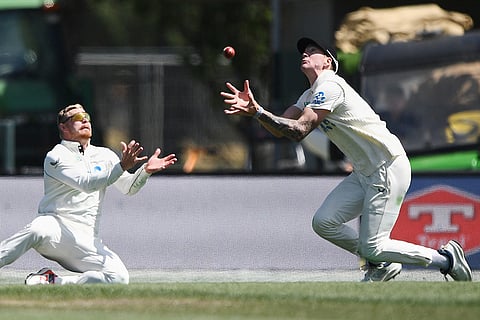 New Zealand fielders Blair Tickner, right, and Glenn Phillips are unable to field a ball while playing the West Indies on Day 5 of their cricket test match in Christchurch, New Zealand.