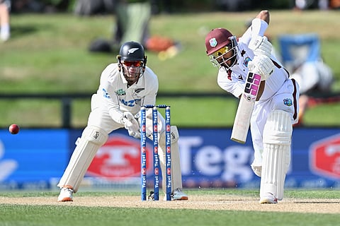 West Indies' Shai Hope, right, bats in front of New Zealand's Tom Blundell on Day 4 of their cricket test match in Christchurch, New Zealand.