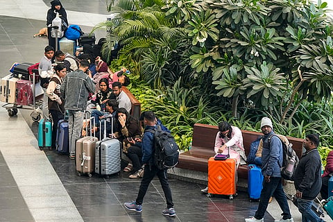 Passengers wait at Terminal 1 (T1) of the Indira Gandhi International Airport, in New Delhi.  
