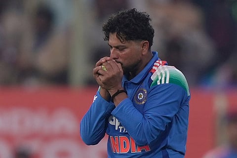 India's Kuldeep Yadav takes the catch on his own bowling to dismiss South Africa's Corbin Bosch during the third One Day International cricket match between India and South Africa in Visakhapatnam.