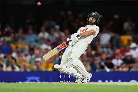 Australia's Michael Neser stays away from a bouncer delivery during the second Ashes cricket test match between Australia and England in Brisbane.