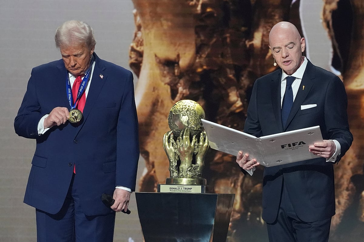 AP Photo/ Evan Vucci  : President Donald Trump is presented with the inaugural FIFA Peace Prize by FIFA President Gianni Infantino during the 2026 FIFA World Cup draw at the Kennedy Center, Friday, Dec. 5, 2025, in Washington.