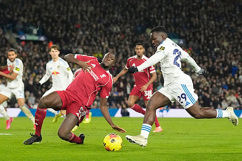 Liverpool's Ibrahima Konate fouls Leeds United's Wilfried Gnonto, right, during the English Premier League soccer match between Leeds United and Liverpool in Leeds, England.