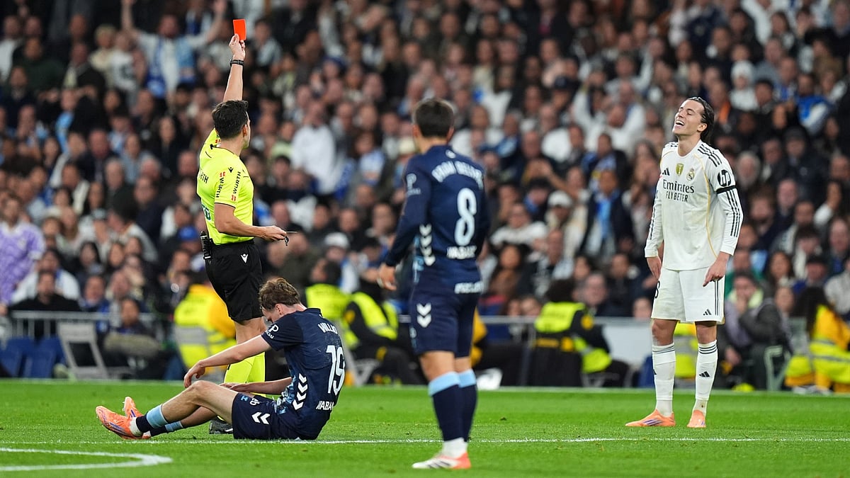 Alvaro Carreras receives a red card.