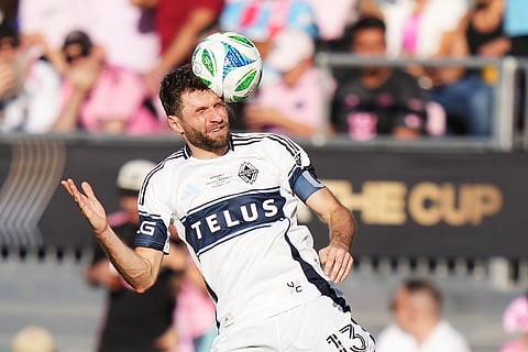 Vancouver Whitecaps' Thomas Muller (13) heads the ball against Inter Miami during the second half of the MLS Cup final soccer match, in Fort Lauderdale, Fla.