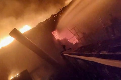 Smoke and flames billow after a fire broke out due to a cylinder blast at a nightclub, in North Goa. At least 23 people were killed in the incident, according to officials.