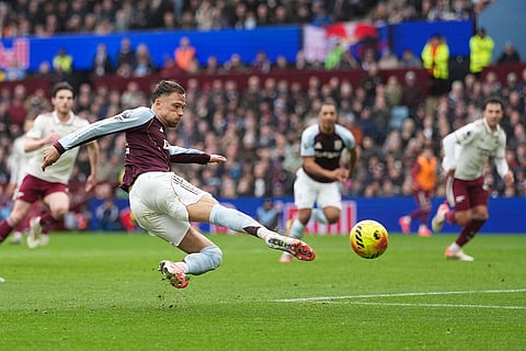 Aston Villa's Matty Cash scores his side's opening goal during the English Premier League soccer match between Aston Villa and Arsenal in Birmingham, England.