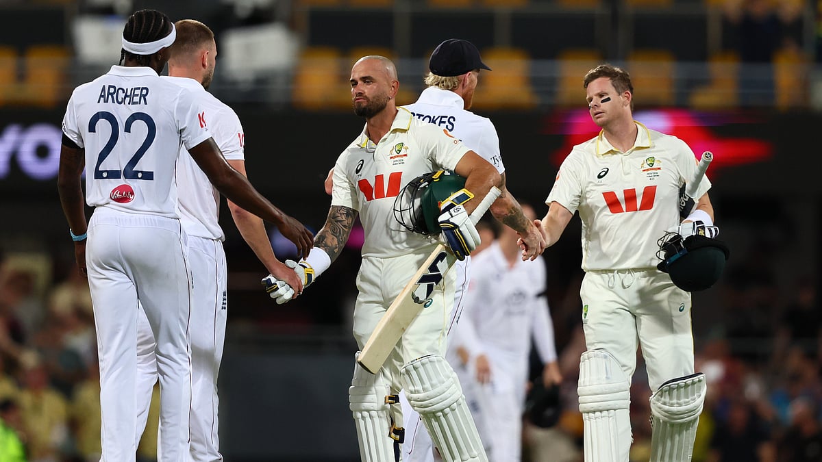 AP : Australia's Jake Weatherald, front, and Australia's captain Steve Smith shake hands with England's players after winning the second Ashes Test.