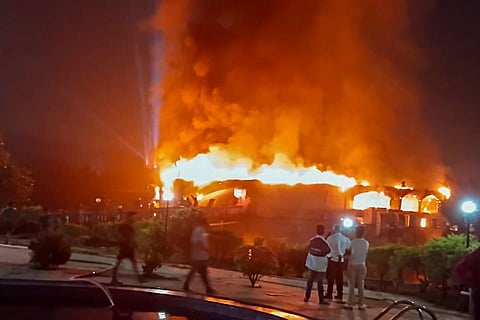 Smoke and flames billow after a fire broke out due to a cylinder blast at a nightclub, in North Goa. At least 23 people were killed in the incident, according to officials.