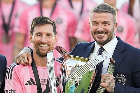 David Beckham poses with the MLS Cup trophy with Inter Miami forward Lionel Messi in Fort Lauderdale, Fla.