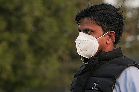 New Delhi: A commuter wears a mask amid deteriorated air quality, in New Delhi.