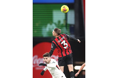 Chelsea's Pedro Neto, left, and Bournemouth's Adrien Truffert in action during the English Premier League soccer match between Bournemouth and Chelsea in Bournemouth, England.