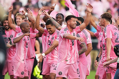 Inter Miami players celebrate after winning the MLS Cup final soccer match against the Vancouver Whitecaps in Fort Lauderdale, Fla.