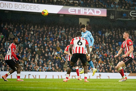 Manchester City's Phil Foden scores his side's third goal during the English Premier League soccer match between Manchester City and Sunderland in Manchester, England.